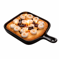 Southlake Gifts Skillet S’mores Dessert Candle burning in a black skillet pan on a clean background, featuring marshmallows, chocolate pieces, and cookie crust design, a handmade novelty candle inspired by campfire s’mores and a perfect foodie gift for birthdays, housewarming parties, and dessert lovers.