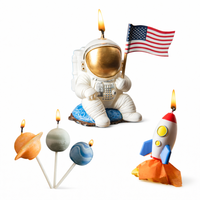 Southlake Gifts space themed candle set featuring astronaut, rocket, and planet candles in. the white back ground.