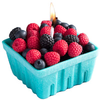 Southlake Gifts Berry Basket Candle in a white background, glowing with lifelike blueberry, raspberry, and blackberry wax melts.