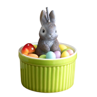 Southlake Gifts Bunny Easter Candle Bowl displayed unlit on a white background, featuring a gray bunny with pastel wax eggs in a green ceramic bowl, a handmade Easter décor candle perfect for seasonal gifting.