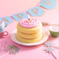 Southlake Gifts cake cookie candle styled as a birthday centerpiece on a pastel table, featuring a handmade vanilla scented cookie cake candle with pink frosting and sprinkles, perfect as a cake topper and a unique birthday gift for dessert lovers and celebration décor