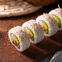 Southlake Gifts California Roll Sushi Candles displayed individually on a wooden board, handmade novelty food candles with realistic sushi details for unique gifts.