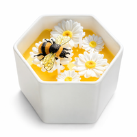 Hand-poured Southlake Gifts Daisy Beehive Candle Bowl styled with daisies made by wax and honey jar in white background — a nature-inspired, gift-ready candle for birthdays, housewarmings, and holidays.