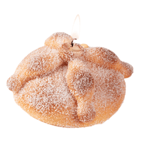 Realistic Pan de Muerto bread candle handmade with vanilla scent and sugar wax detail. Southlake Gifts Day of the Dead cultural food candle.