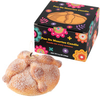 Southlake Gifts Pan de Muerto Candle gift set. Handmade vanilla scented bread candle with sugar wax detail in Día de los Muertos themed packaging box.