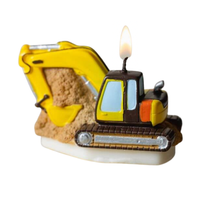 Southlake Gifts Excavator Candle is lit in a white back ground. A handmade soy wax construction themed candle ready as cake topper and cake decoration.