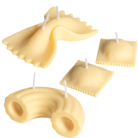 Set of ravioli pasta candles, Farfalle pasta candle and rigatoni pasta candle on a white background