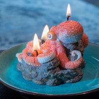 Southlake Gifts Octopus Candle side view, handmade sea-salt scented marine candle with rocky reef wax base and plate display