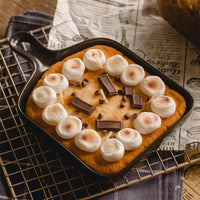 Southlake Gifts Skillet S’mores Chocolate and Marshmallow Candle in a real skillet pan with cookie base, toasted marshmallows, chocolate bars, and chocolate chips, a realistic handmade dessert candle inspired by classic campfire s’mores, a unique novelty candle and perfect foodie gift for birthdays, housewarmings, holidays, or dessert lovers.