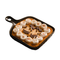 Southlake Gifts handmade Skillet S'more Chocolate and Marshmallow Candle with a cookie dough food shape wax melt at the bottom, marshmallow candle wax melt, Chocolate candle wax melt, and chocolate chops candle wax melt put together and sit in a white background.