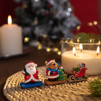 Santa and reindeer wax figures inside holiday candle, handmade Christmas décor with sleigh of gifts, floral fruit gourmand fragrance