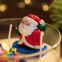 Close-up of Santa Claus wax figure inside handmade Christmas Candle, festive scented décor gift by Southlake Gifts