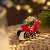 Miniature sleigh filled with gifts, hand-painted wax figure in Southlake Gifts Christmas Candle, holiday décor and gift idea
