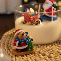 Reindeer with Christmas tree wax figure in holiday candle, handmade festive wax decoration for Christmas centerpiece