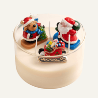 Handmade Christmas Candle with Santa, reindeer, and sleigh wax figures in glass vessel, festive holiday centerpiece by Southlake Gifts in white background