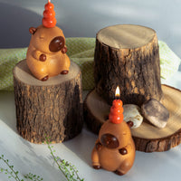 Handmade Capybara Candle pair by Southlake Gifts, whimsical animal candles with stacked orange topper, fruity fragrance, and calming décor charm