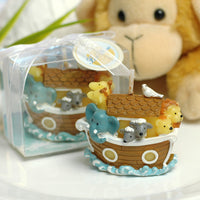 Noah's Ark Candle with cute elephant, goat, lion, and other animals on it.
