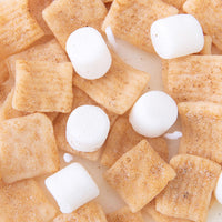 Close-up of Southlake Gifts Cinnamon Toast Crunch Cereal Candle showing lifelike wax cereal squares and marshmallows — an artisan handmade candle ideal for gifting during holidays or birthdays.