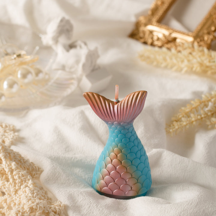 Let the Metallic Mermaid Tail Candle dive into your cake.