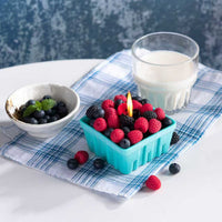 Southlake Gifts Berry Basket Candle lit and glowing with handmade blueberry, raspberry, and blackberry wax melts, displayed on a table as a realistic fruit candle and artisan home décor piece — a thoughtful gift for berry lovers and unique home décor. 