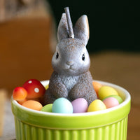 Close-up of Southlake Gifts Bunny Easter Candle Bowl with a hand-sculpted gray bunny and colorful wax eggs, a handmade novelty candle designed for Easter decorating and thoughtful spring gifting.