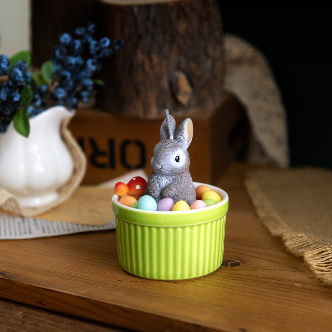 Southlake Gifts Bunny Easter Candle Bowl styled on a tabletop with rustic décor, showcasing a bunny and pastel egg design in wax, a charming Easter candle that doubles as a spring home décor gift.