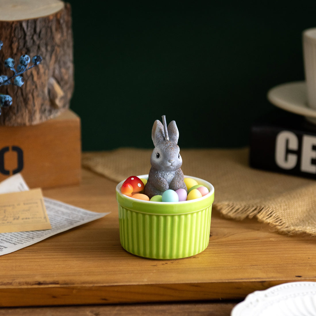 Southlake Gifts Bunny Easter Candle Bowl displayed as seasonal home décor, featuring a gray bunny and pastel wax eggs in a green bowl, a handmade Easter candle ideal for gifting and spring displays.