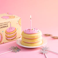 Southlake Gifts cake cookie candle with gift-ready packaging box displayed on a pastel pink background, a handmade vanilla scented dessert candle styled as a birthday cake topper, perfect as a ready-to-gift candle for celebrations, party décor, and unique gift ideas for her