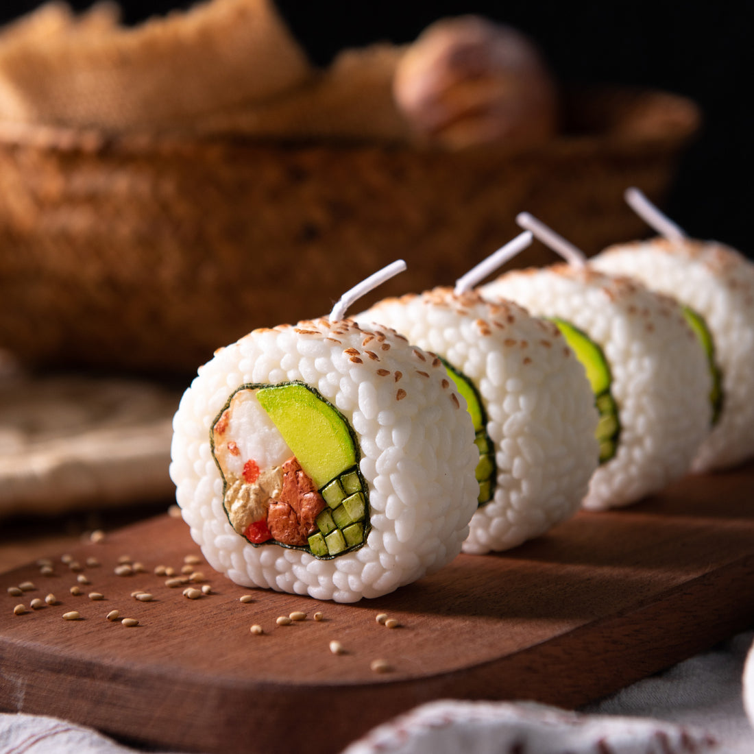 Southlake Gifts California Roll Sushi Candle collection on a wooden serving board, handmade novelty food candles with realistic sushi details, a unique gift for sushi lovers.