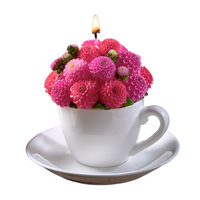 Southlake Gifts handmade Dahlia Flower Teacup Candle is lit up, pink wax bouquet in porcelain-style cup and saucer, floral scented décor gift in white background.