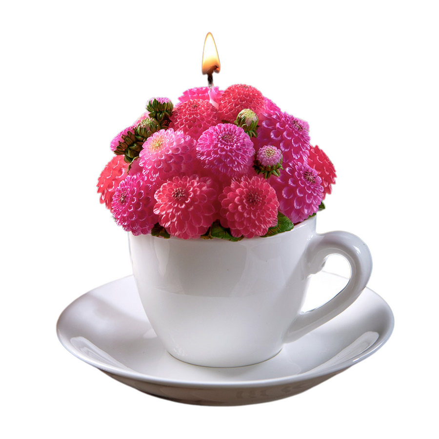 Southlake Gifts handmade Dahlia Flower Teacup Candle is lit up, pink wax bouquet in porcelain-style cup and saucer, floral scented décor gift in white background.