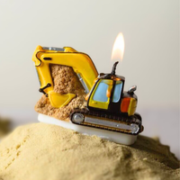 Southlake Gifts Excavator Candle displayed lit on sand, a handmade construction-themed candle cake topper that mimics a real excavator, a playful party favor and thoughtful gift for construction birthday celebrations.