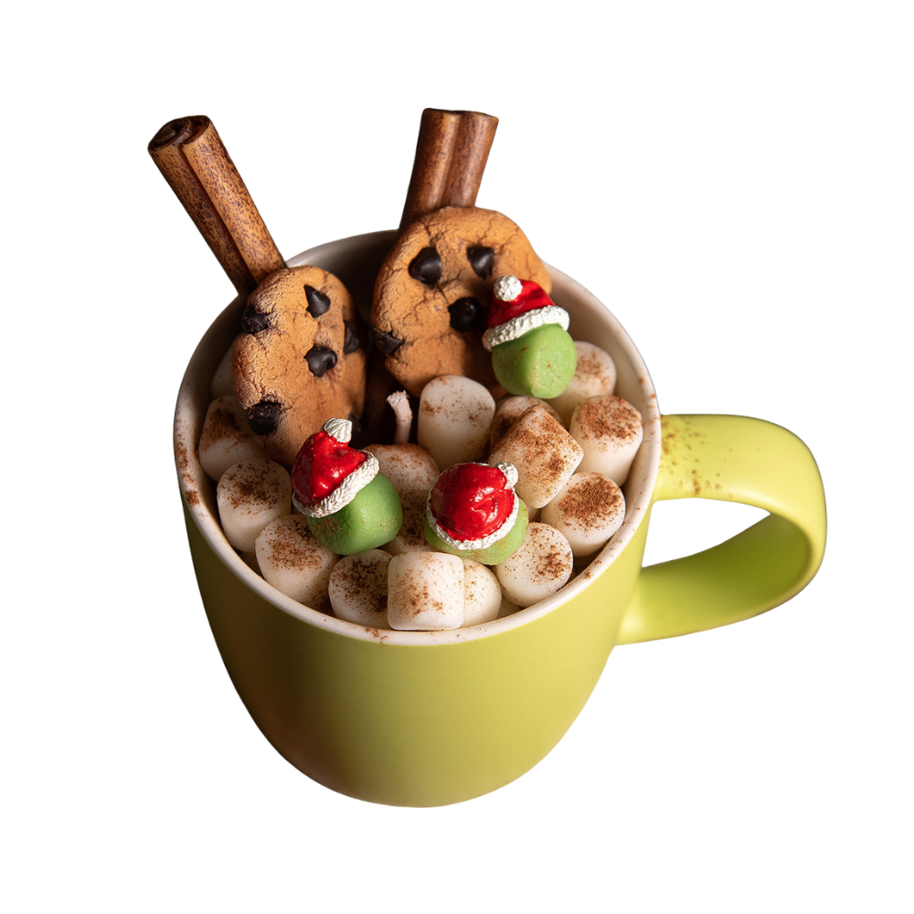 Front view of unlit cocoa candle mug with handcrafted soy wax cookies and Santa hat marshmallows — cozy Christmas candle décor by Southlake Gifts.