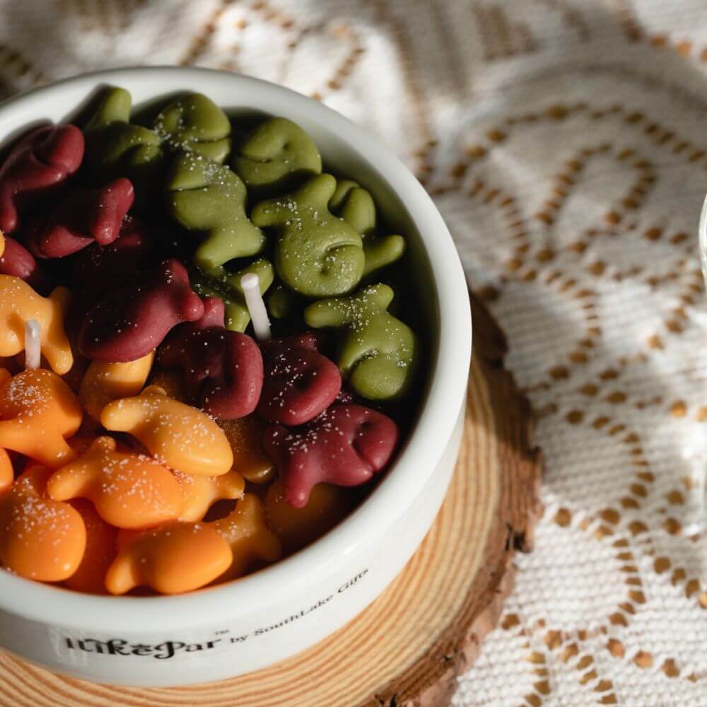 Detail view of colorful wax fish melts inside Southlake Gifts Fish & Crackers Candle Bowl, realistic handmade candle art ideal for gifting or brightening your home.