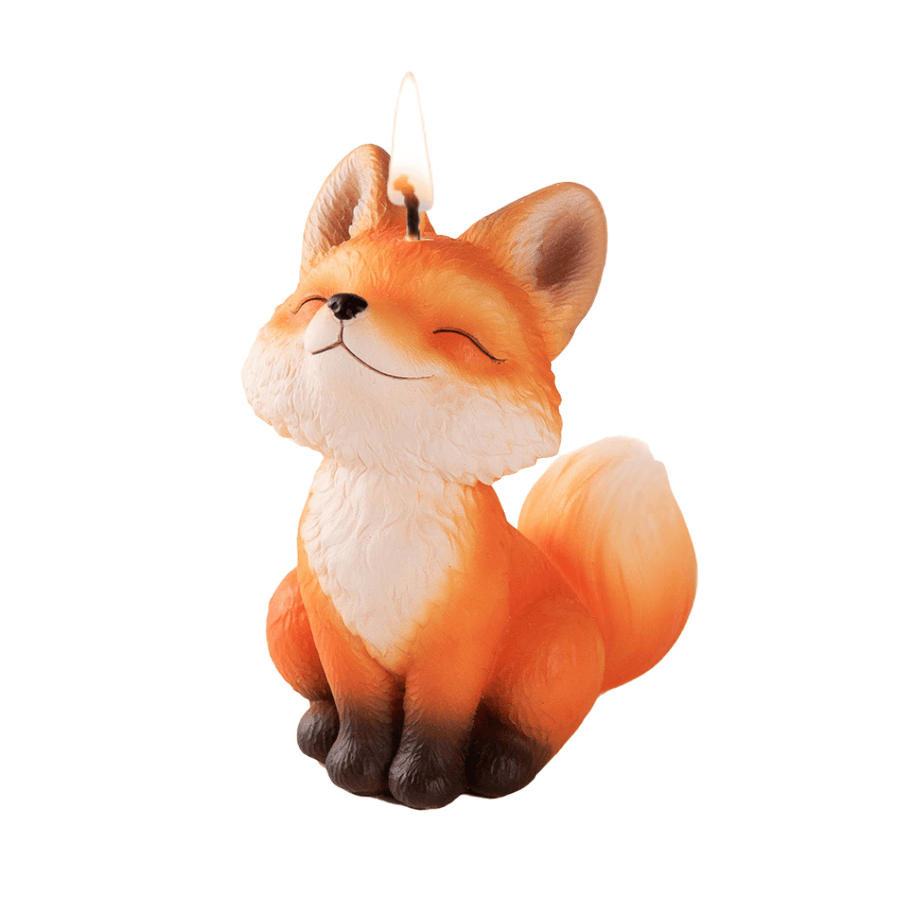 Southlake Gifts Fox Candle lit up in a white back ground. 