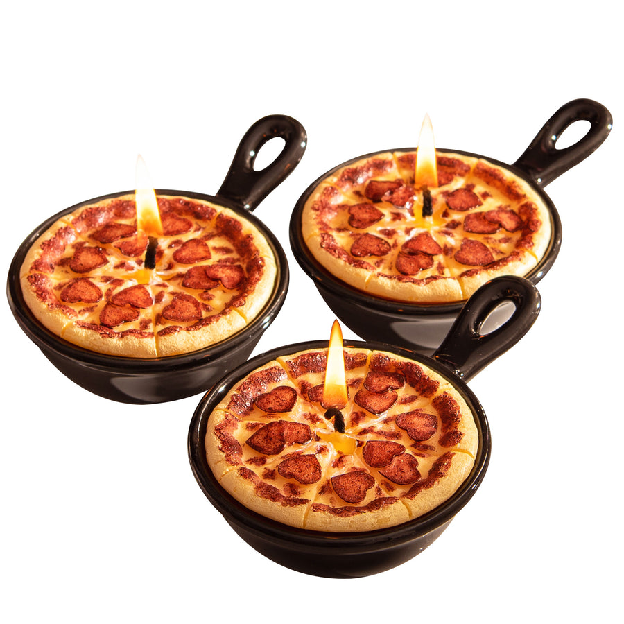 A clean white-background view of the Southlake Gifts Heart Pepperoni Mini Pizza Candle Trio, featuring three lit miniature pepperoni pizza candles in black skillets, a quirky handmade food candle gift perfect for pizza lovers and unique décor gifts
