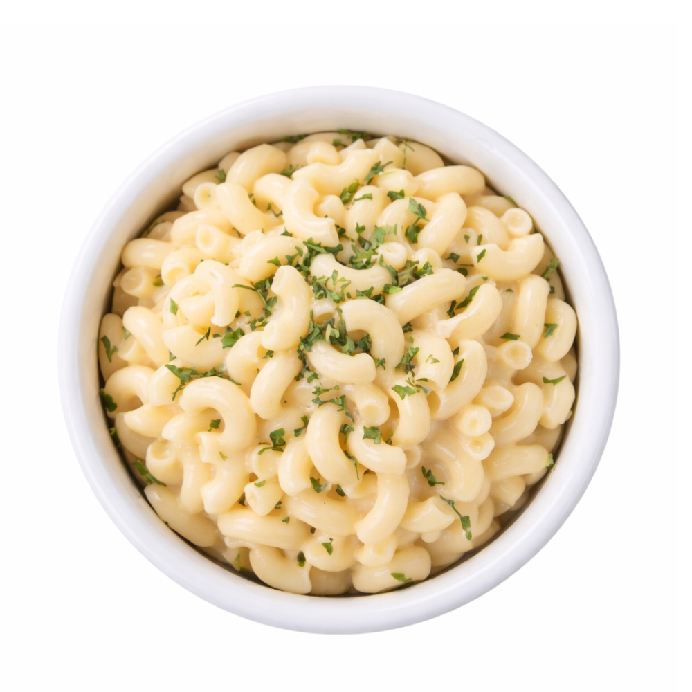 Southlake Gifts Macaroni and cheese with green herbs in a white bowl on a white background