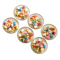 Southlake Gifts close-up of colorful cereal wax melts inside small glass bowls, showing the charm and texture of these realistic food-inspired candles — an artisan home décor accent that makes a joyful and gift-ready surprise.