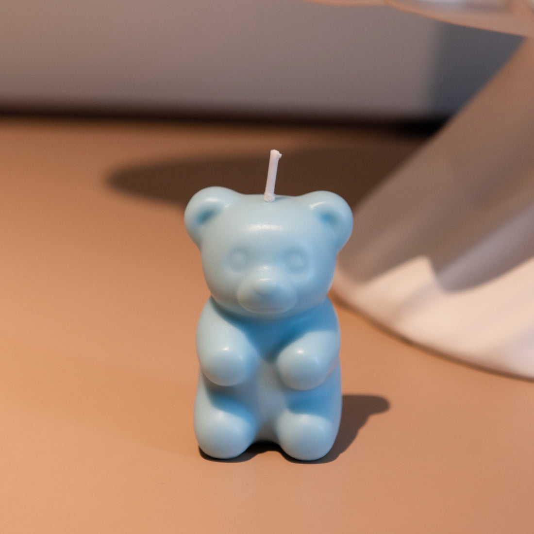 Southlake Gifts blue gummy bear candle standing upright, scented novelty candy-inspired candle made from soy wax, a charming gift for candle lovers and fun décor fans.