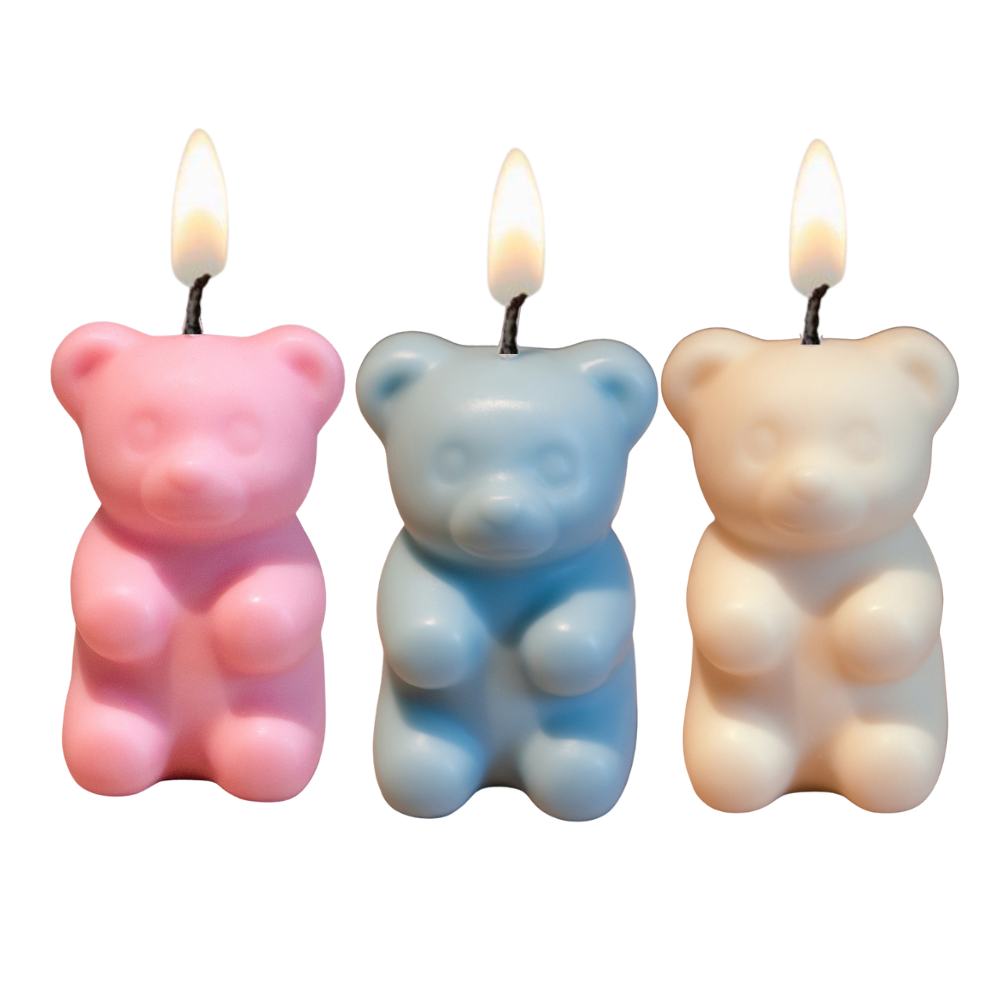 Southlake Gifts gummy bear candles lit with soft flame on white background, handmade soy wax novelty candles with hidden surprise inside, a unique gift for candle lovers.