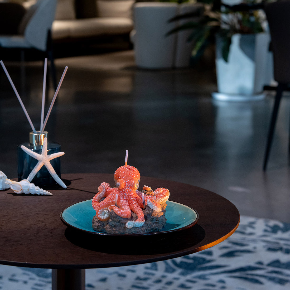 Southlake Gifts Octopus Candle displayed on table with plate, handmade sea salt scented marine décor candle for coastal style homes