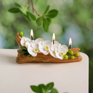 Southlake Gifts Orchid Flower Arrangement Candle lit with glowing flames on all three wicks, handmade soy wax orchids on realistic wood base which is also made by wax, truly a luxury floral centerpiece décor for everyday. 