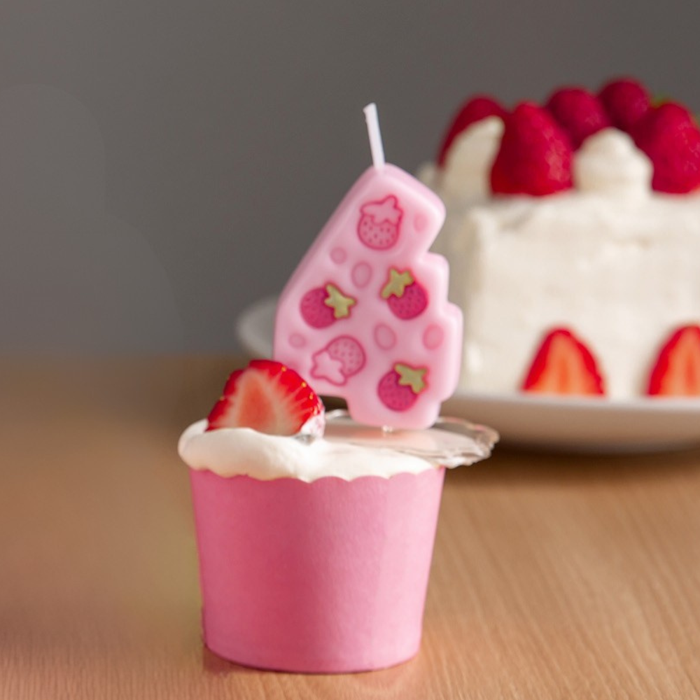 Southlake Gifts Pink Strawberry Number Four candle stick on top of a cupcake as a cake topper 