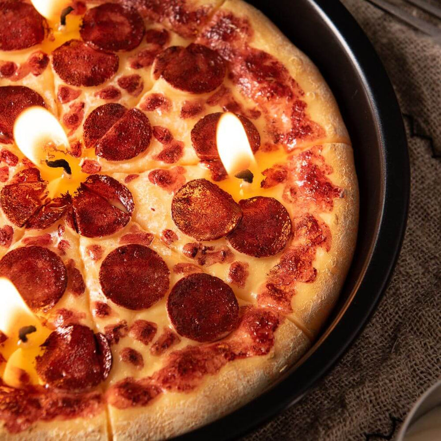 A closer look of the pizza candle and lighted.