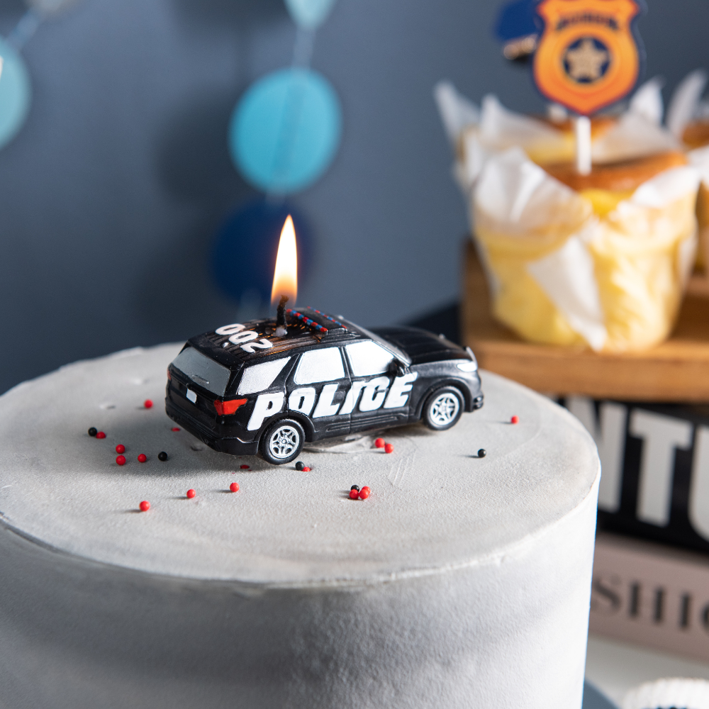 Southlake Gifts police car candle close up on birthday cake, detailed patrol vehicle candle design for police themed party, unique novelty gift for police officer, first responder appreciation gift and cop themed birthday decor