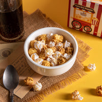 Southlake Gifts Popcorn Candle Bowl styled on a cozy movie-night table with a cola glass and vintage style candle package featuring hand-poured butter and caramel popcorn wax melts — a handcrafted soy candle and perfect holiday gift for home décor lovers.