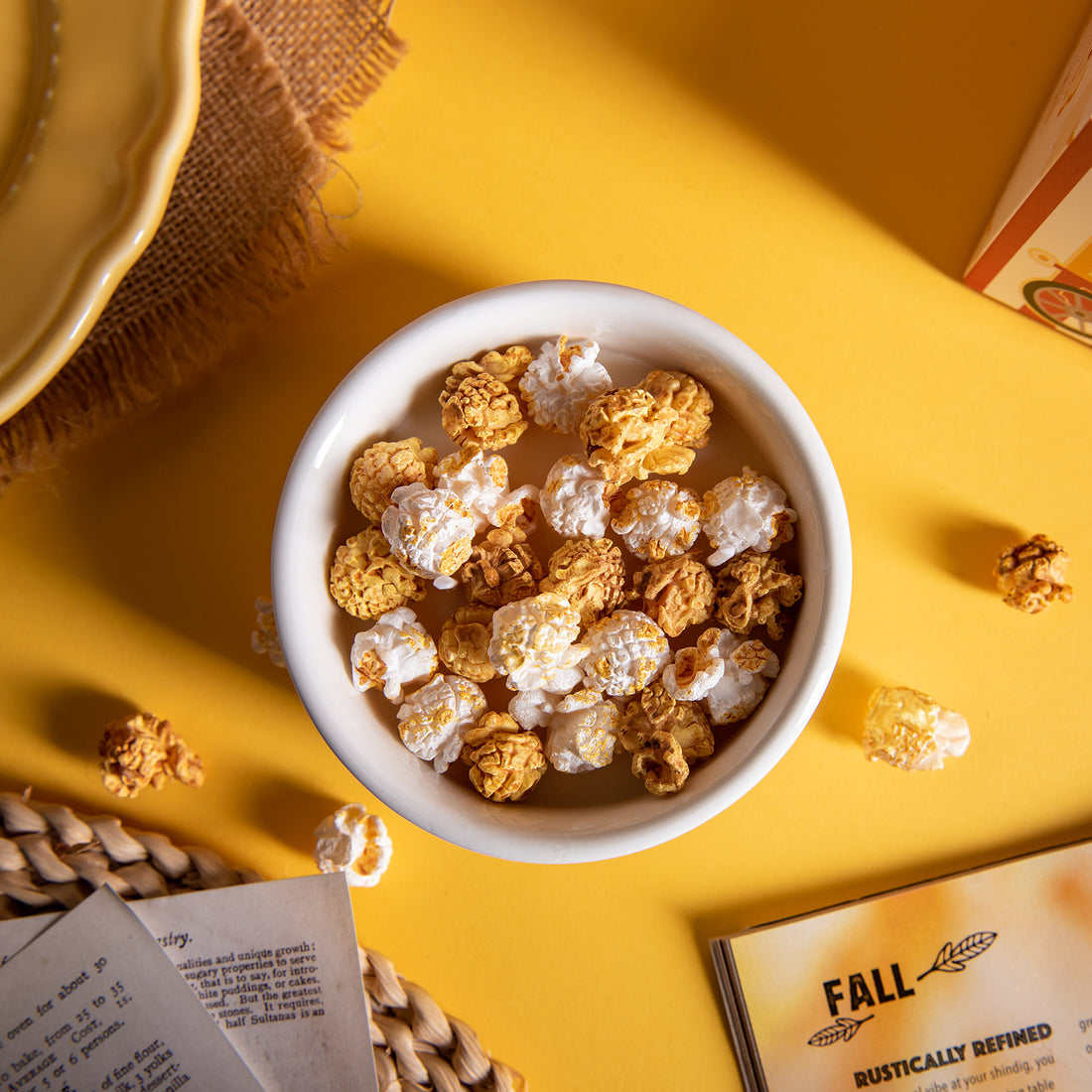 Top view of Southlake Gifts Popcorn Candle filled with realistic white and golden popcorn wax melts representing butter and caramel flavors, a handmade novelty candle that makes a whimsical gift for movie and candle lovers.