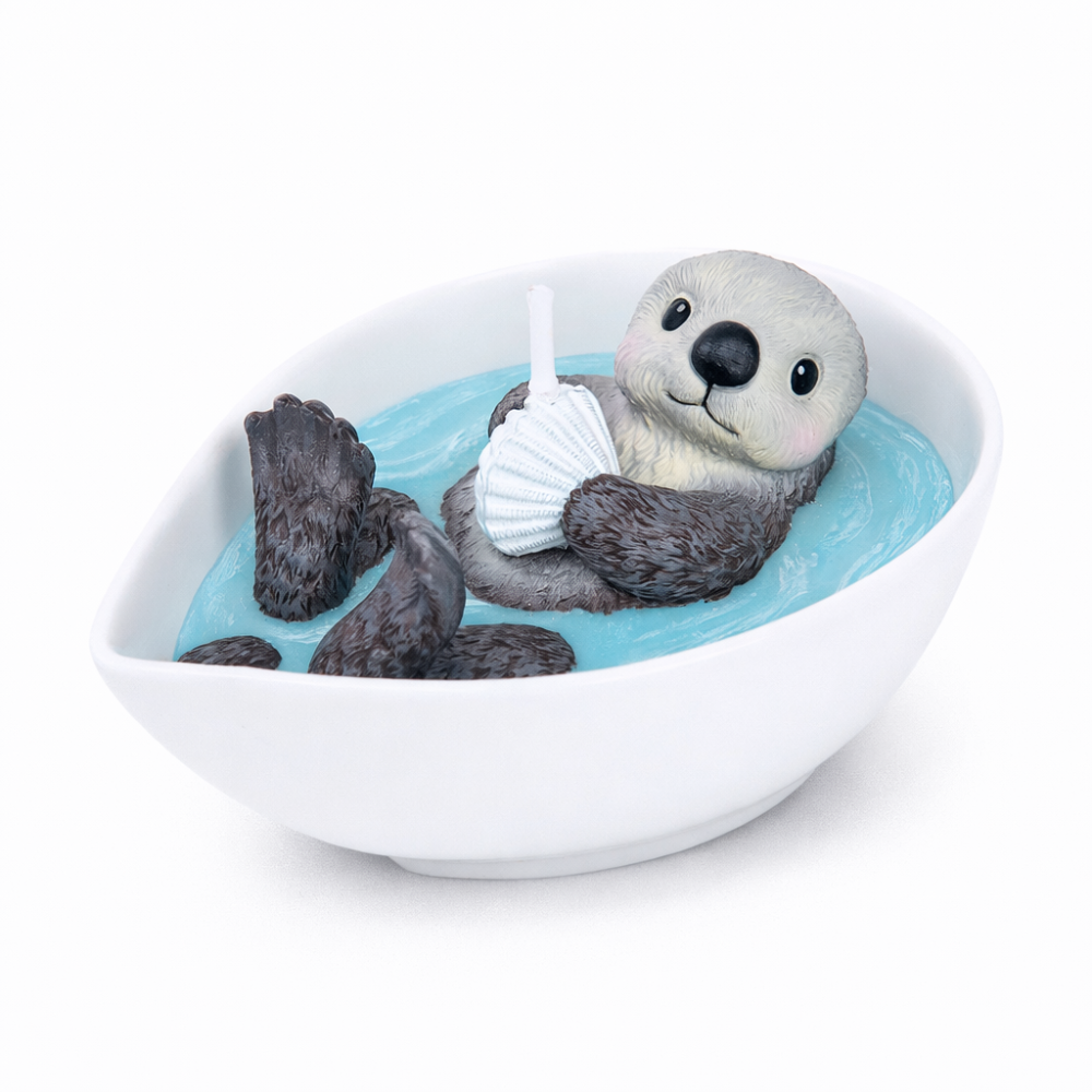 Product studio shot of the Southlake Gifts Sea Otter Candle unlit, showing detailed otter sculpture in turquoise wax pool, a handmade realistic candle for home décor and gifting.