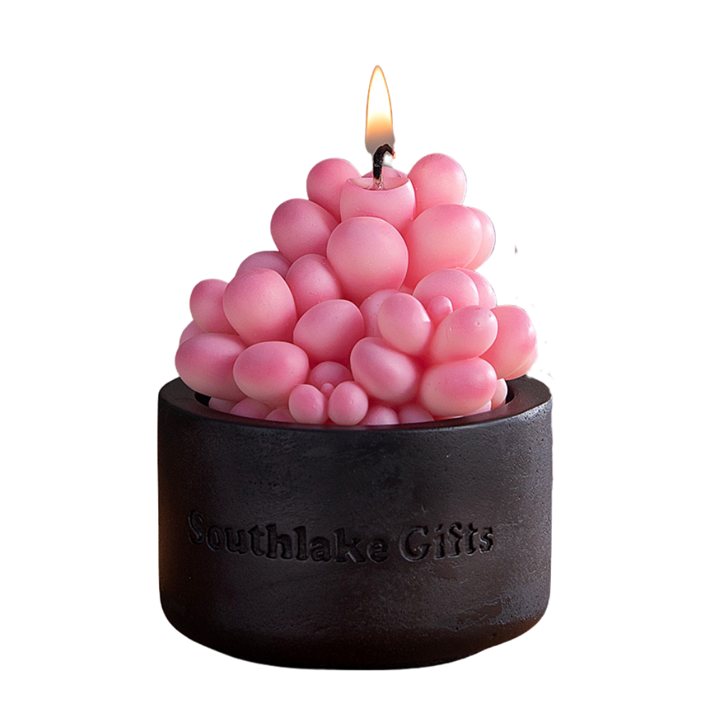 Lit Pink Moonstone Candle emits a soft pink glow from its handcrafted succulent form, a soothing handmade candle that doubles as art décor and an ideal gift for any special occasion.