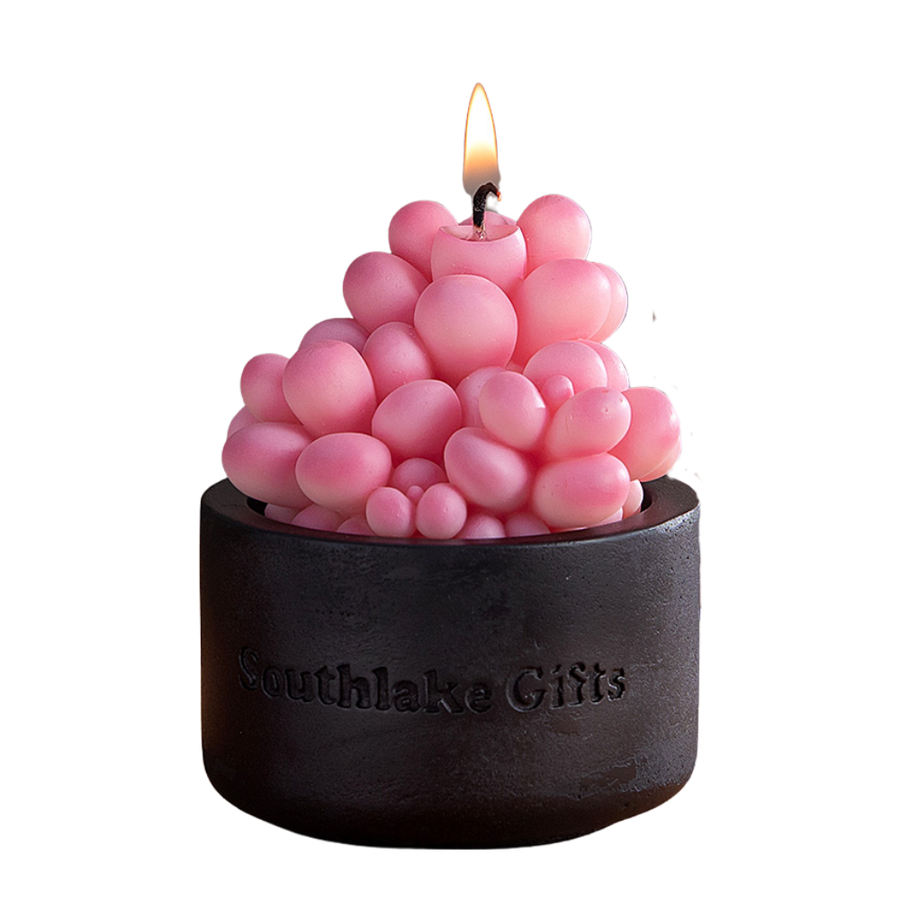 Lit Pink Moonstone Candle emits a soft pink glow from its handcrafted succulent form, a soothing handmade candle that doubles as art décor and an ideal gift for any special occasion.